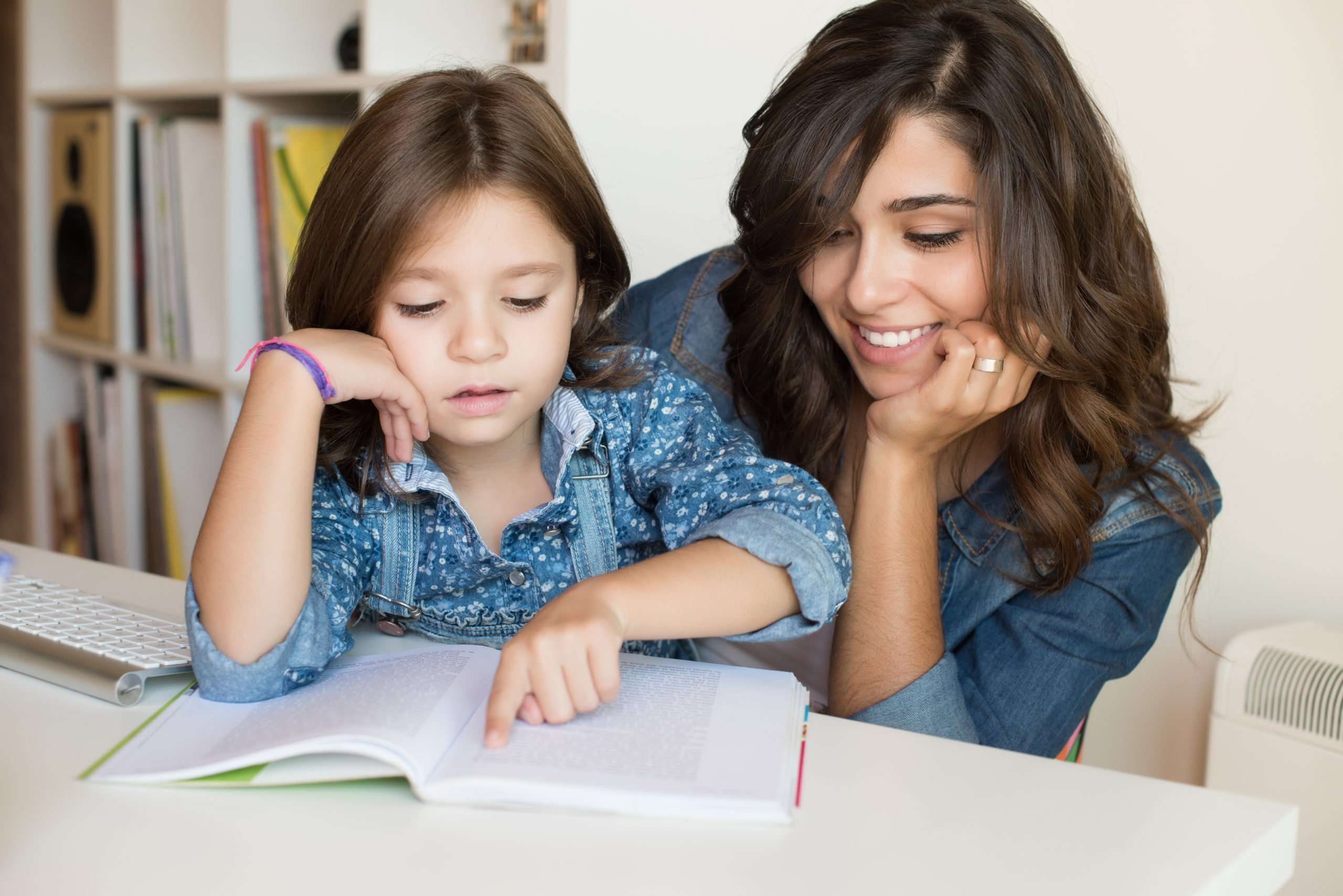 Mother helping child with homework